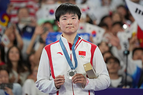 Badminton Women's singles: China's He Bingjiao celebrates after wining the silver medal